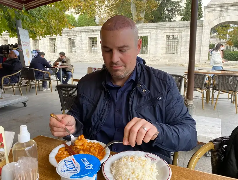 Hair transplant patient eating in a restaurant in Istanbul